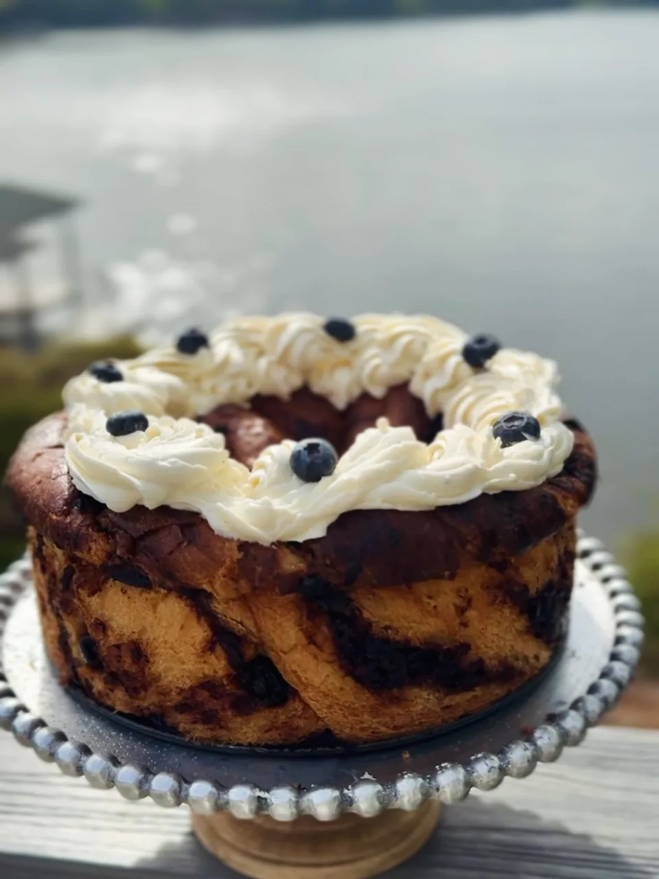 Brioche with piped cream and berries