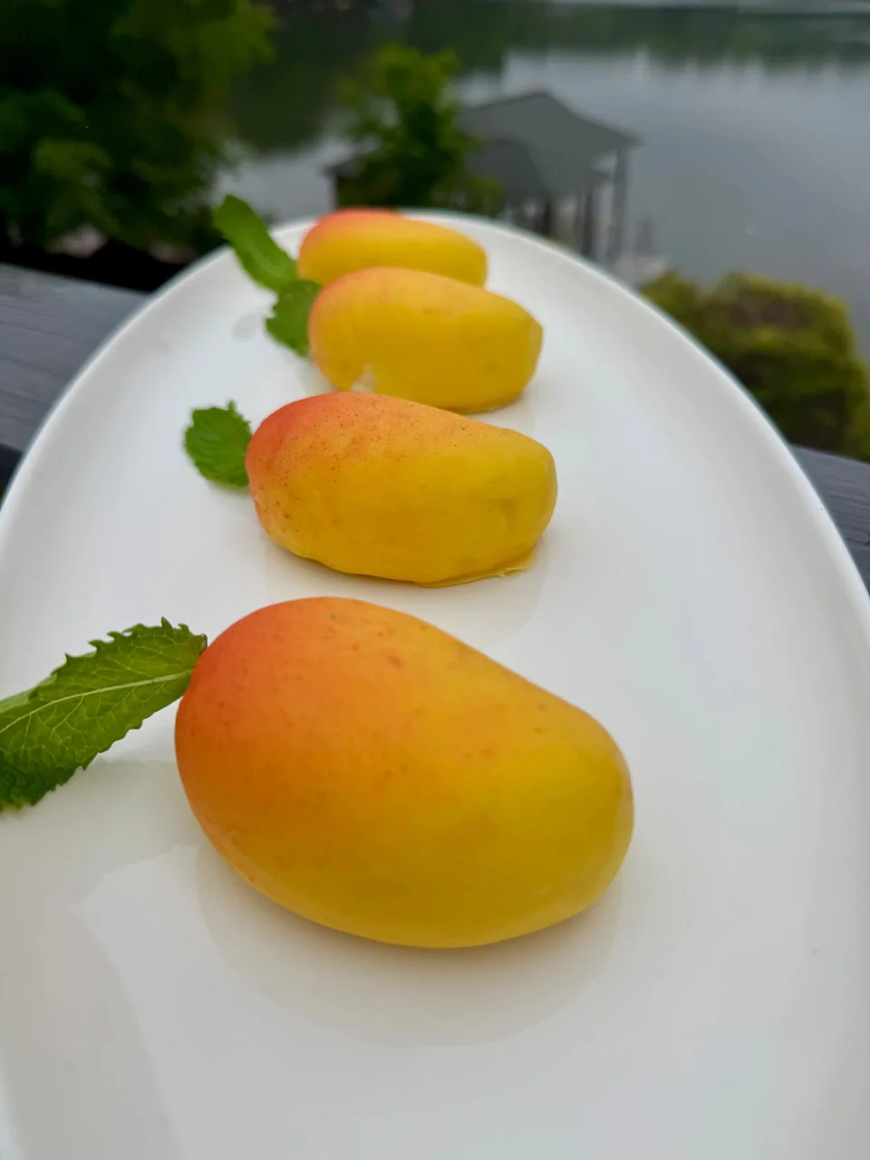 Yellow fruit-shaped mousse pastries