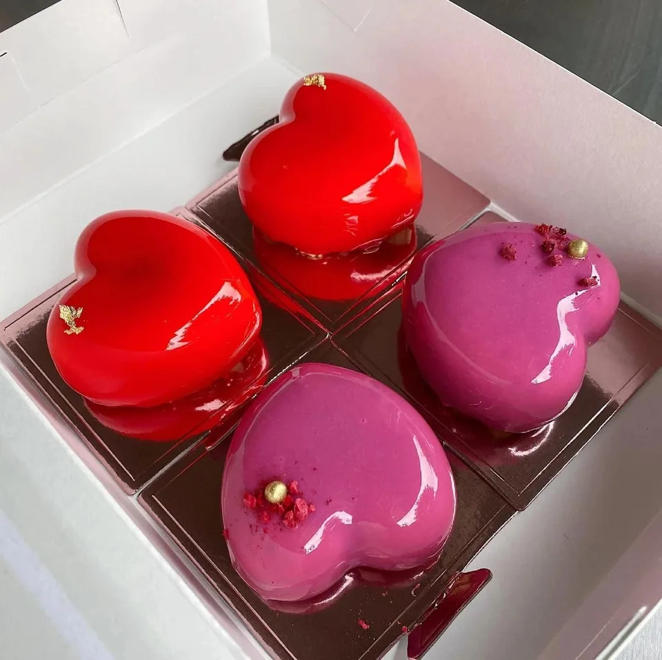 Heart-shaped glazed mousse cakes