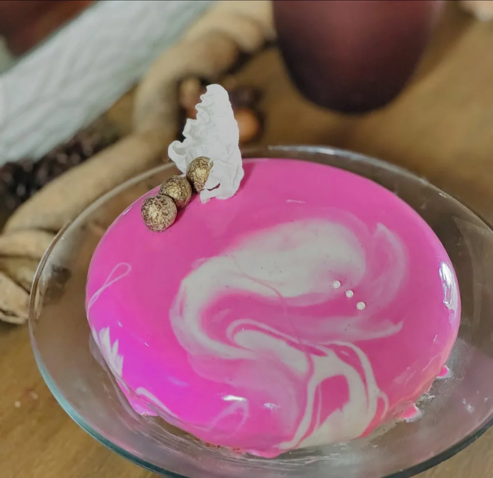 A pink-and-white marbled mousse cake