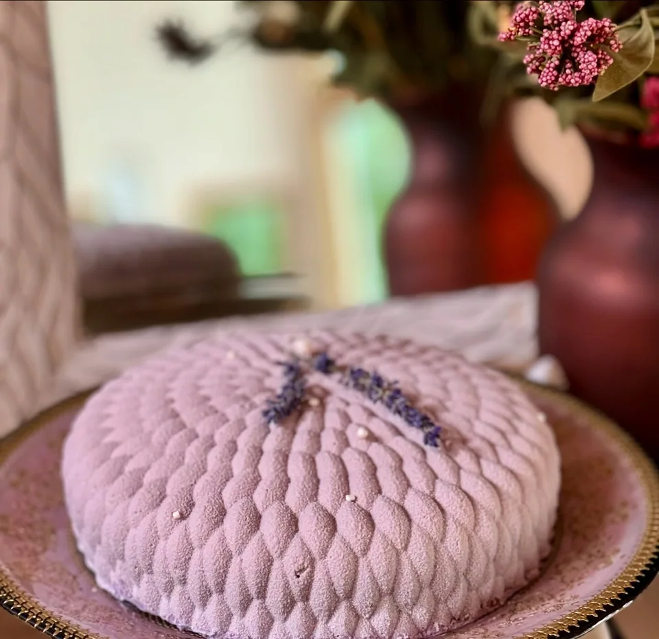 A sculpted lilac mousse cake